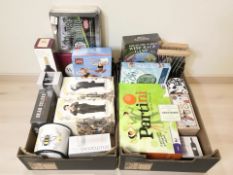 A group of board games, household sundries,