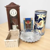 A large pottery stick stand, a stained glass panel, a glass fruit bowl,