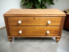 A Victorian pine two drawer low chest, 132 cm x 52 cm x 75 cm.
