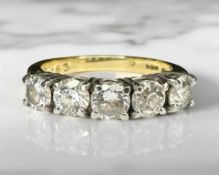 An 18ct yellow gold five stone diamond ring, the stated total diamond weight 1.63ct, size N½.
