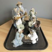Five Chinese earthenware figures and groups.
