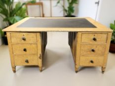 A Victorian scumbled pine twin pedestal partner's desk, fitted six drawers to each side,