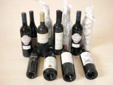 Twelve various bottles of alcohol including Familia Deicas, Mar Lindo, St. Henri shiraz, etc.