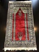 An Anatolian prayer rug, 144 cm x 76 cm.