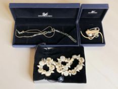 A group of boxed Swarovski jewellery including a panelled necklace, pendant and a further necklace.