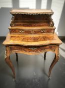 A French rosewood, amboyna, and satinwood-strung lady's writing desk, circa 1900,
