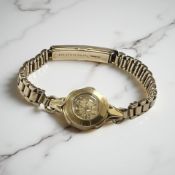 A 9ct yellow gold Omega Lady's wristwatch on 9ct gold strap, case 14 mm.