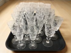 A collection of crystal drinking glasses in various sizes.