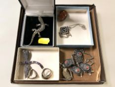 A silver and marcasite lizard brooch, a further amethyst set dragonfly brooch, a yellow metal ring,