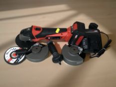 An Einhell cordless disk grinder and various fittings,