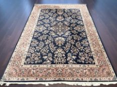 An Indian carpet on midnight floral ground,