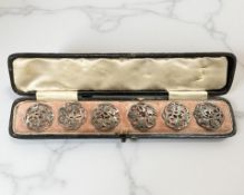 A set of six silver fret work buttons, London 1903, cased.