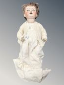 A Simon & Halbig German porcelain jointed doll, makers mark impressed to back of head,