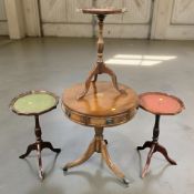 A reproduction mahogany pedestal drum table, diameter 50 cm, and three various wine tables.