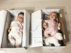 Two Ashton Drake collector's dolls in boxes.