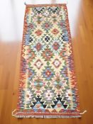 A Chobi Kilim runner, 145 cm x 60 cm.