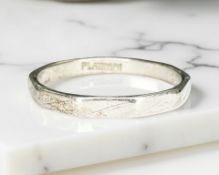 A platinum band ring, size L/M. CONDITION REPORT: 3.1g.