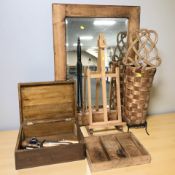A modern pine framed mirror, 96 cm x 68 cm, together with a small easel, a wicker basket,