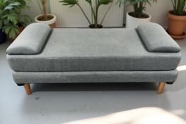 A contemporary day bed in grey fabric, 200 cm x 80 cm x 55 cm.