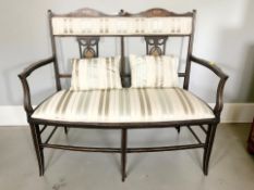 A late Victorian mahogany and satinwood marquetry inlaid two seater salon settee,