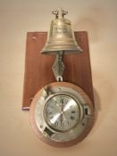 A brass ship's bell on teak plaque, marked IPA Flensburg, May 1987,