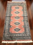 A Lahore Bokhara rug, Pakistan, 195 cm x 103 cm.