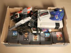 A Nintendo Entertainment System NES version Model NESE-001, together with several games,