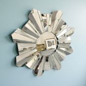 A contemporary frameless sunburst mirror, diameter 111 cm.