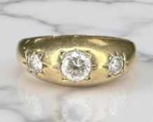 A 9ct yellow gold three stone dress ring, size P/Q. CONDITION REPORT: 2.6g.