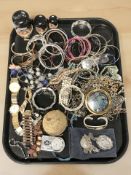 A collection of costume bangles, compacts, lady's wristwatches, etc.