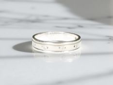 An 18ct white gold band ring, size M CONDITION REPORT: 3.