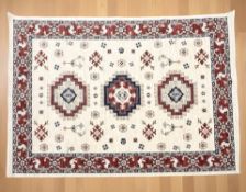 A good quality machine-made carpet of Afghan design,