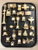 A collection of miniature quartz timepieces.