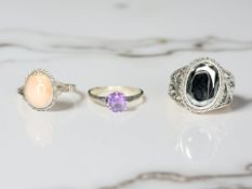 Three Sterling silver rings set with simulated stones.
