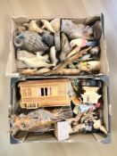 A collection of wooden carvings, model caravan, etc.