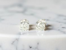 A pair of 18ct white gold diamond stud earrings, total 1.01ct CONDITION REPORT: 1.