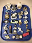 A collection of miniature quartz timepieces.