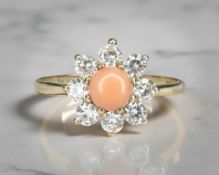 A 9ct yellow gold coral cluster ring, size O. CONDITION REPORT: 1.3g.