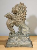A Victorian painted cast iron rampant lion door stop, height 37 cm.