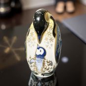 A Royal Crown Derby porcelain Penguin and Chick paperweight, with silver stopper.