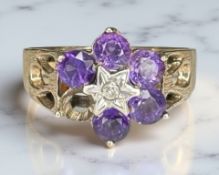 A 9ct yellow gold ring set with synthetic amethyst, size N.