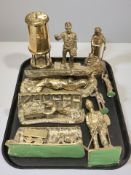 A brass Lamp & Limelight miner's safety lamp and a group of cast brass mining ornaments.