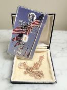 Two silver gilt necklaces and a Benchmark one quarter grain .999 fine gold ingot.