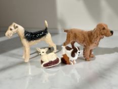 Four Beswick dog figures to include Champion Cast Iron Monarch, Champion Horseshoe Primula etc.