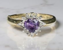 A 9ct yellow gold cluster ring set with heart shaped amethyst, size O/P.