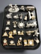 A collection of miniature quartz timepieces.