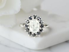 A 9ct white gold synthetic cluster ring, size O CONDITION REPORT: 3.
