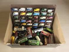 A collection of die cast buses an delivery vans including Corgi and Lledo.