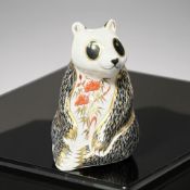A Royal Crown Derby porcelain Panda paperweight, with silver stopper.