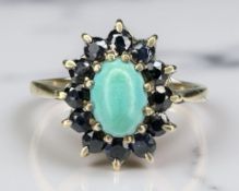 A 9ct yellow gold turquoise cluster ring, size N/O. CONDITION REPORT: 2.2g.